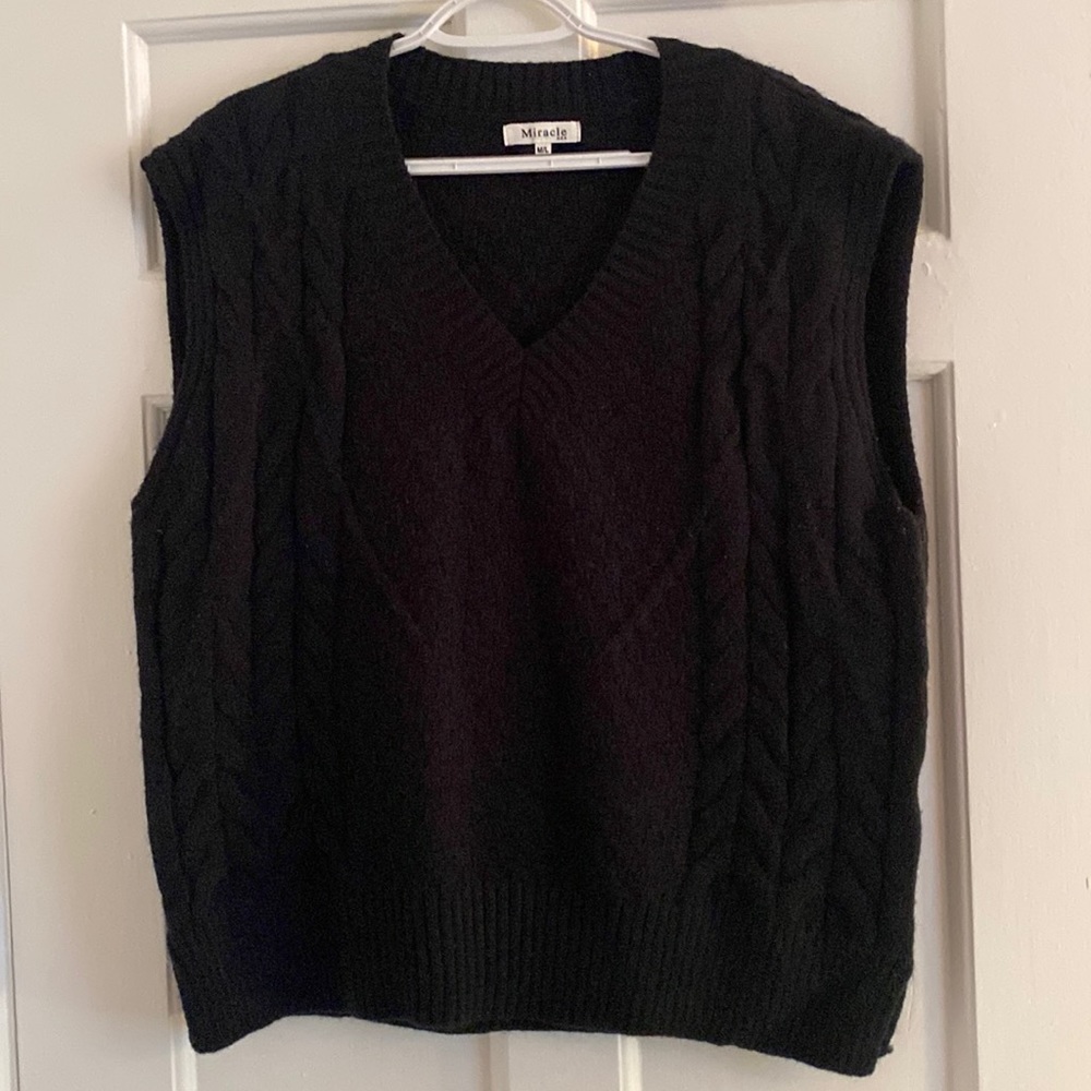 Black sweater vest.
